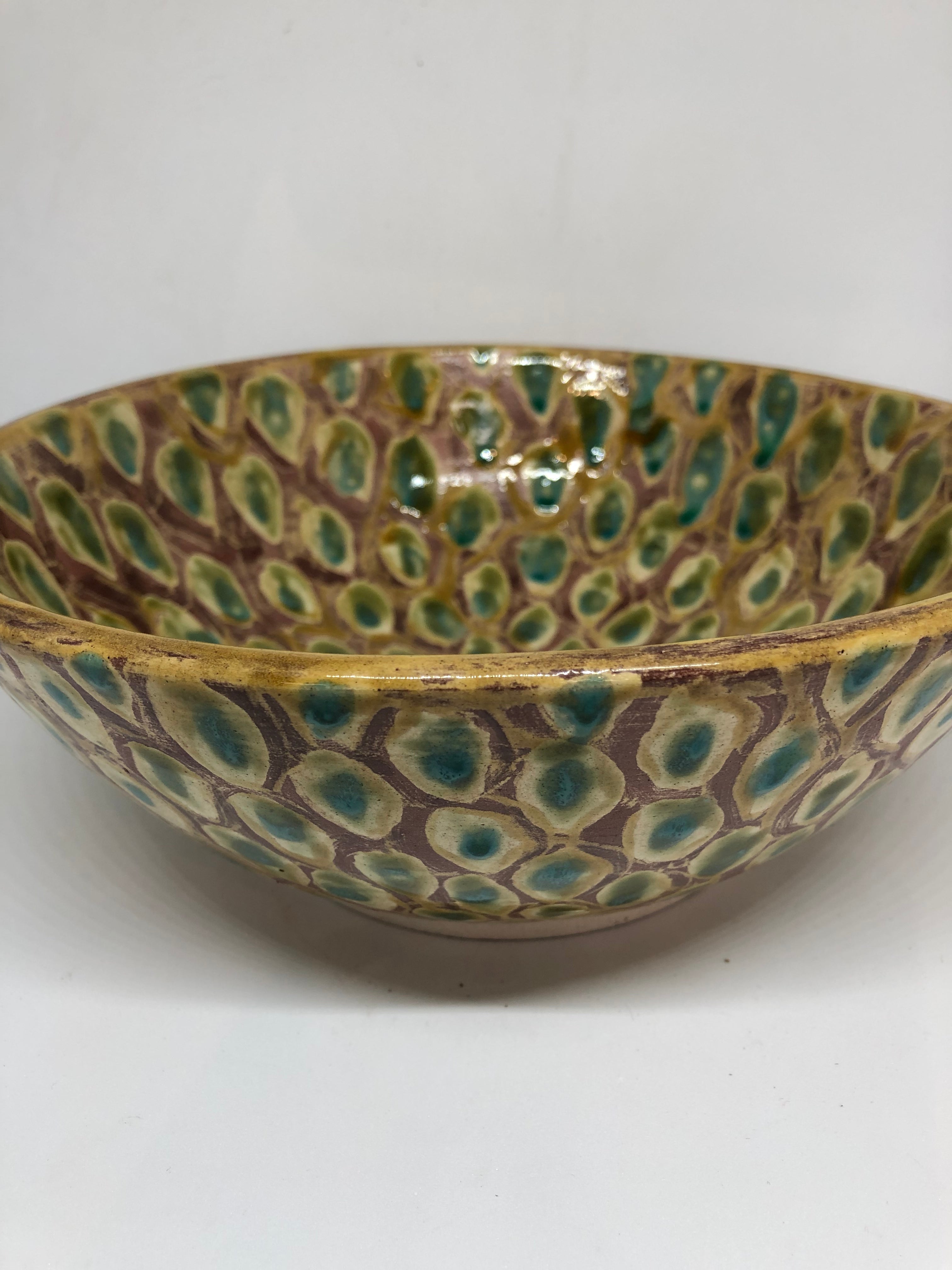 Wheel thrown and hand-decorated ceramic bowl